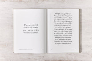 Image of a book with a quote and an open page.