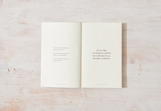 A book with a poem on it, showcasing the beauty of words and emotions through elegant verses.