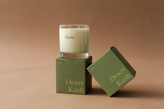 A desert kush candle, featuring a warm and earthy scent perfect for creating a cozy atmosphere at home.