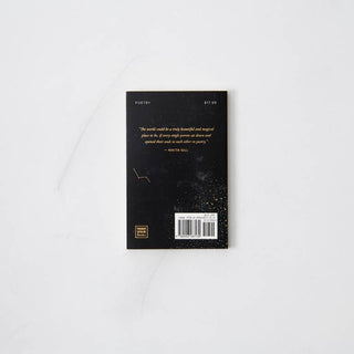 Open book with gold foil cover.