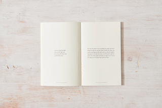 A poetry book showcasing intricate typography on the front and back covers.