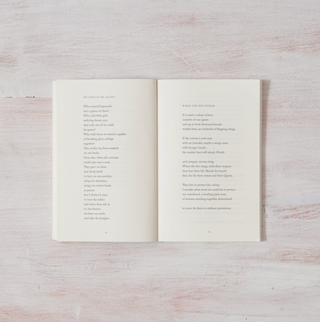 A book with a poem on the front and back cover, showcasing beautiful typography and elegant design