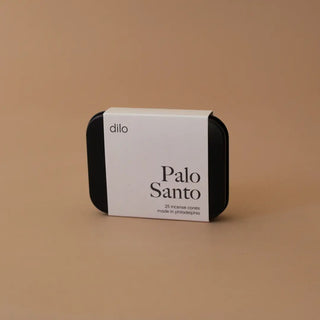 Box of white liquid on table.