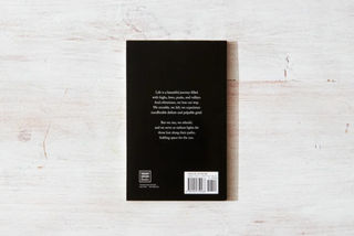 Minimalistic black book cover, sleek and stylish.