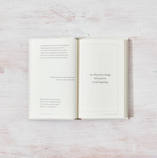 An open book displaying a quote on one of its pages.