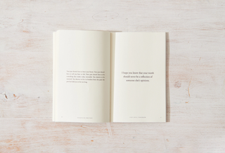 An open book displaying a quote on its page.