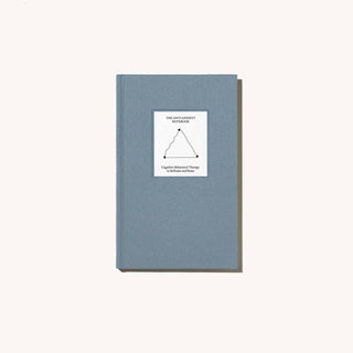 Notebook with triangle design on cover.
