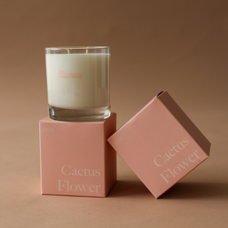 A close-up of a cactus flower candle, showcasing its vibrant colors and intricate details.
