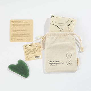 A bag with a green heart-shaped stone and a card, perfect for expressing love and affection.