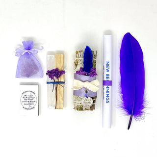 Purple feather, paper, and multiple ribbons in shades of purple on a purple background.