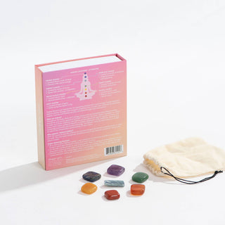 A book with a bag of stones and a pouch, symbolizing knowledge and strength.