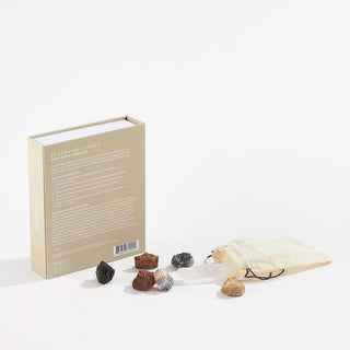 A white surface with a bag of rocks and a book placed on top.