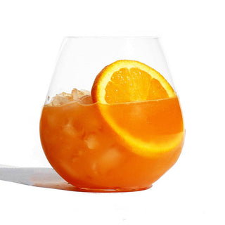 Glass with orange slice, refreshing drink on a hot summer day.