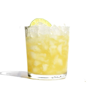 Citrusy lemonade served with lime slices.