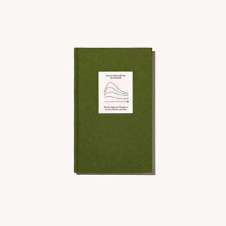 A green notebook with a white label on it, perfect for jotting down notes and organizing thoughts.